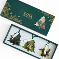 Coffret CITTA de sapins parfumés en cire, avec trois décorations aromatiques présentées dans un écrin vert élégant.