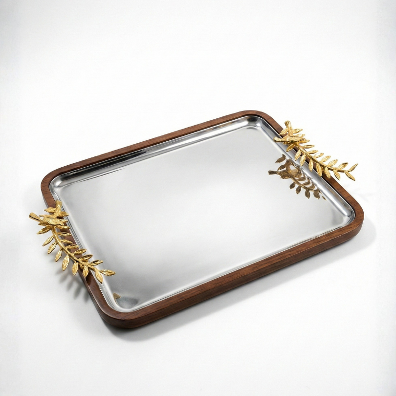 Plateau de service rectangulaire en bois avec fond miroir acier et anses feuillages dorées.